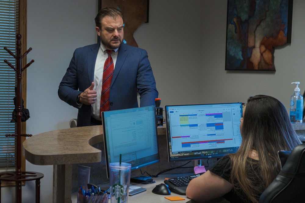 Partovi giving a thumbs up to an employee