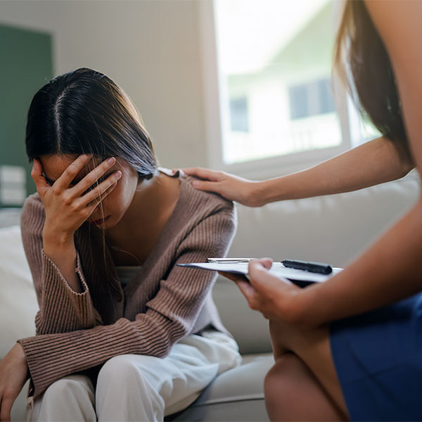 Sad woman in therapy