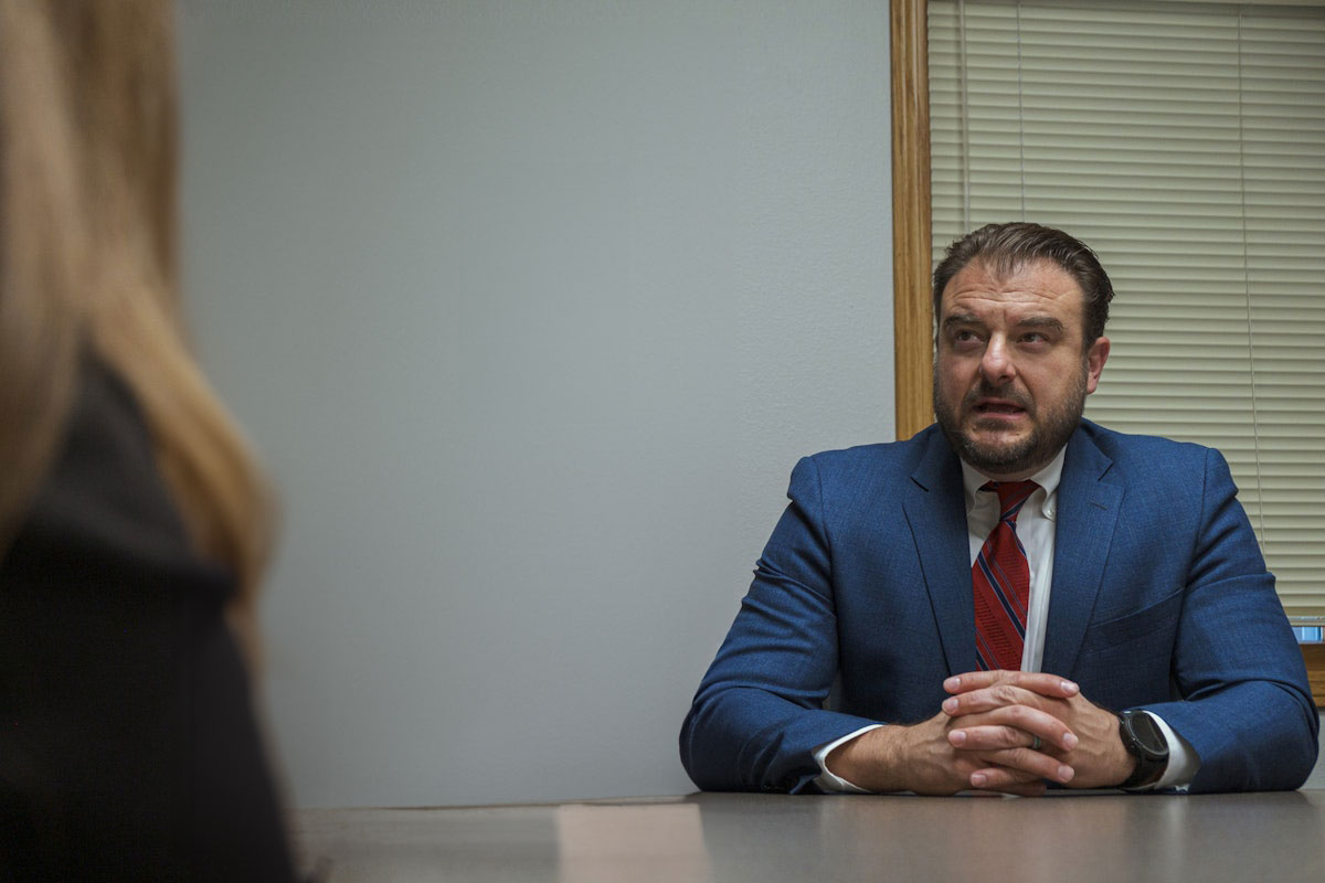 Mr. Partovi discussing a case with a client