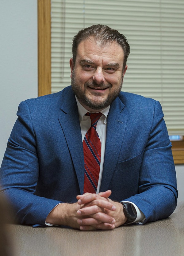 Mr. Partovi talking with client