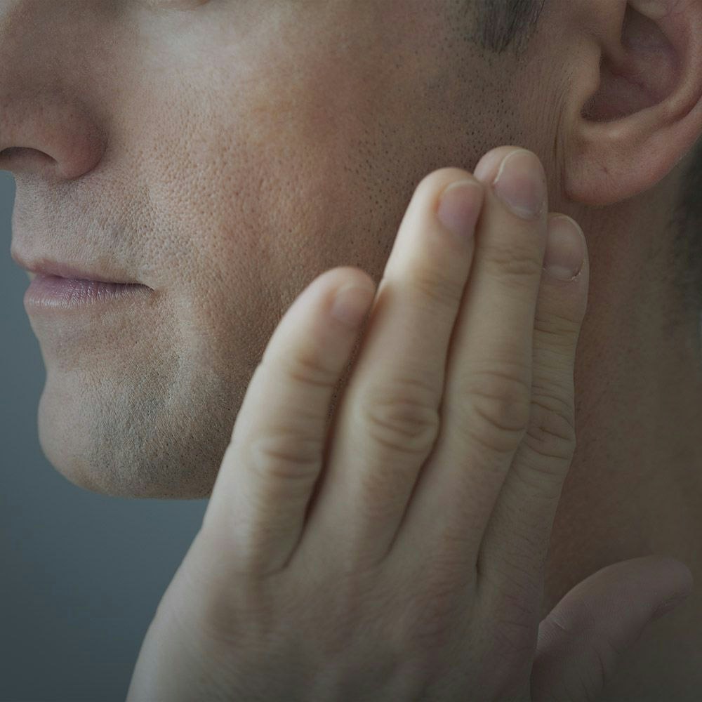 A man with jaw pain