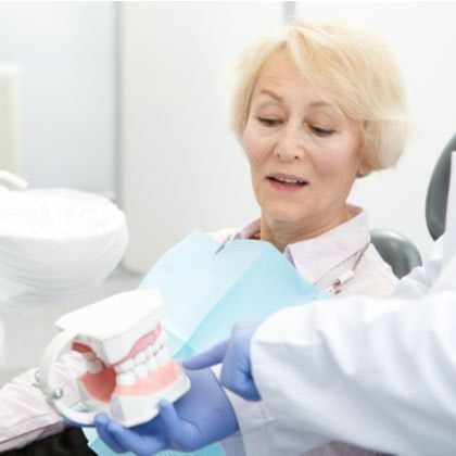 A woman meeting with a dentist