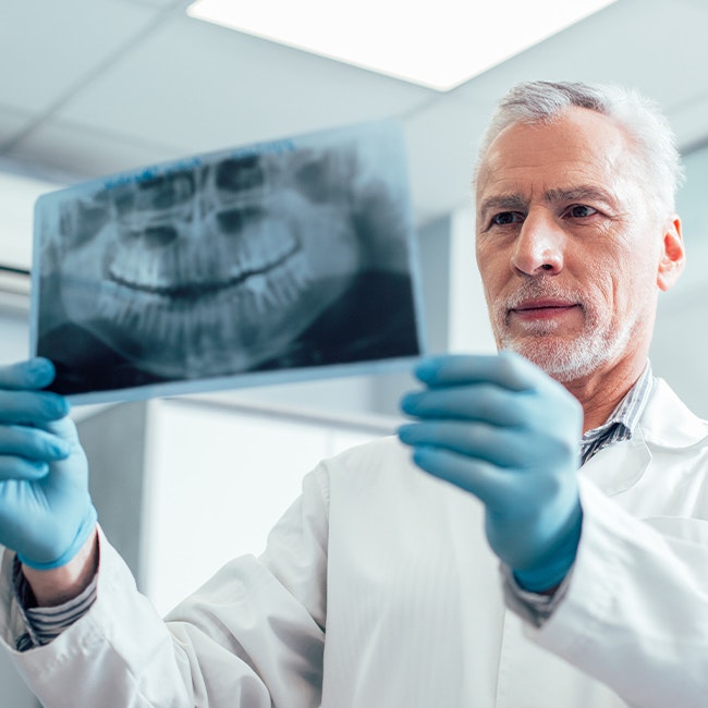 Dentist reviewing imaging