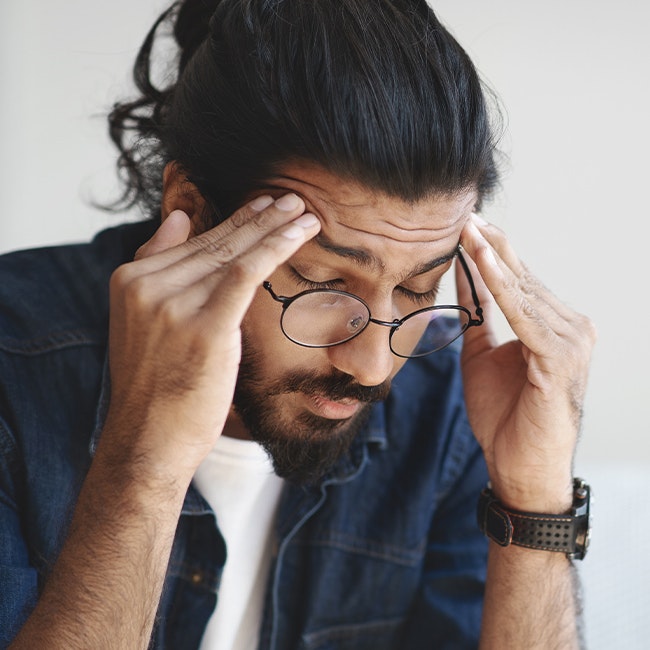Man rubbing temples