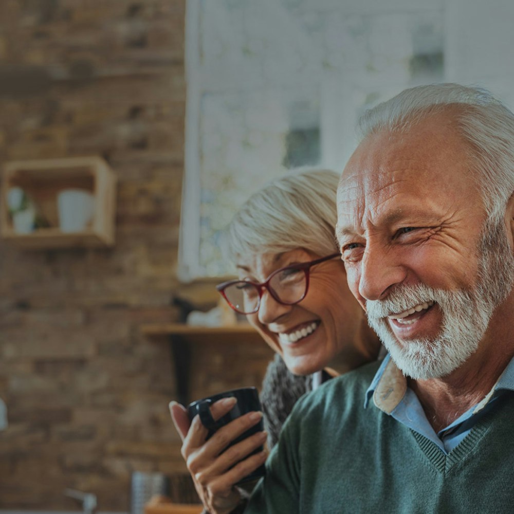 Smiling older couple with dentures