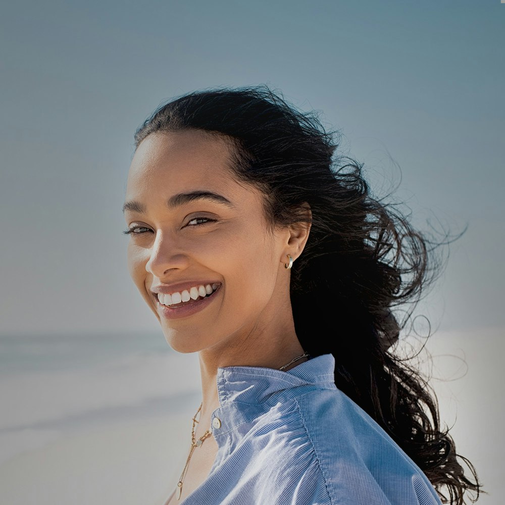 Beautiful smiling woman after teeth cleaning