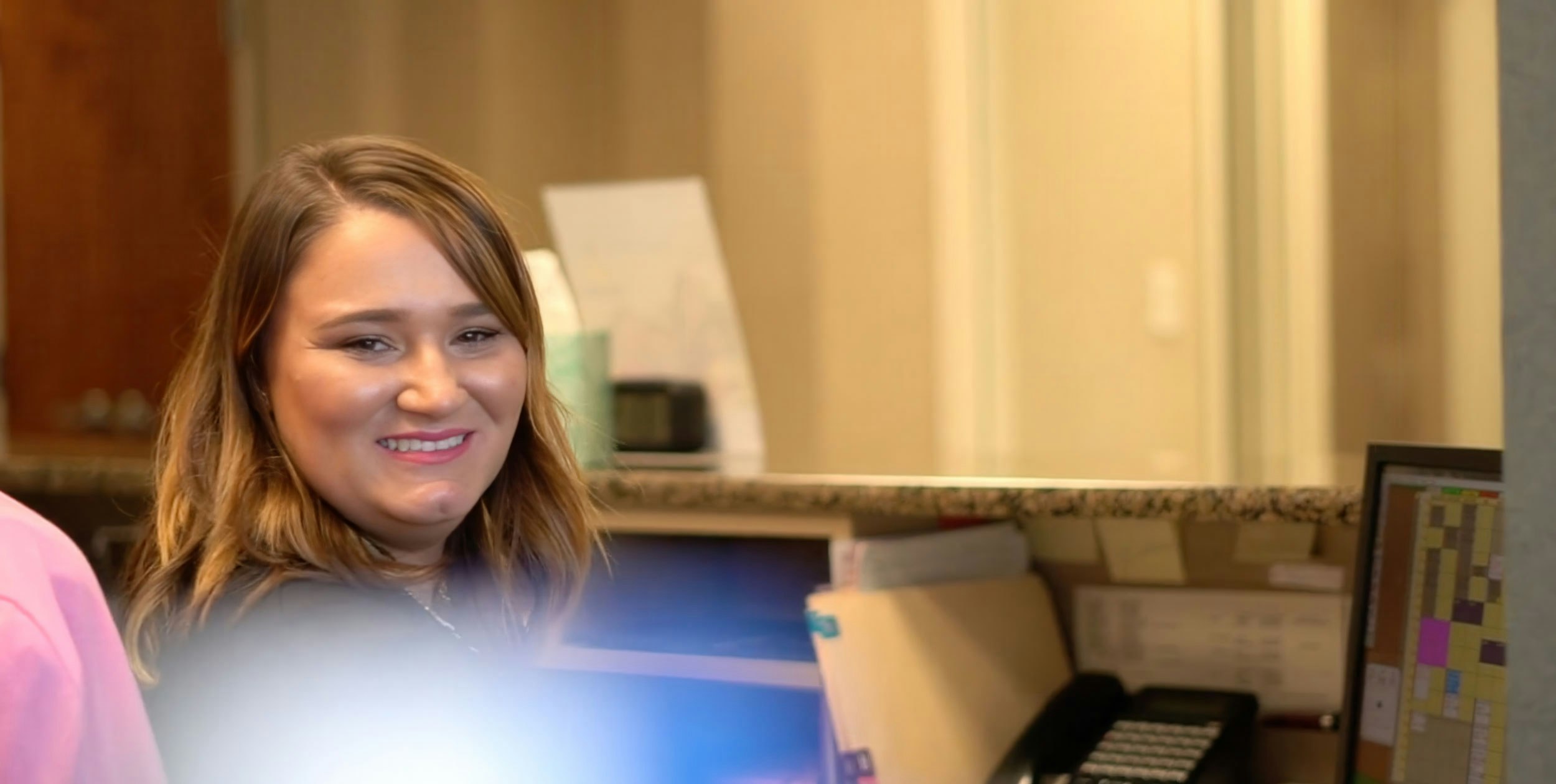 Smiling front office staff