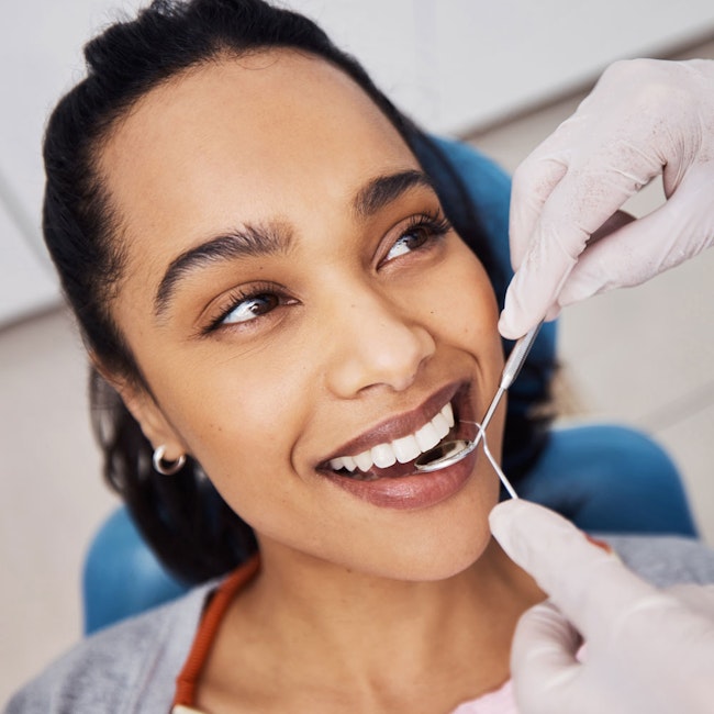 smiling woman showcasing teeth