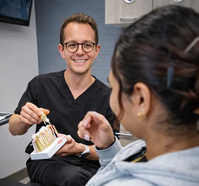 MK Perio dentist showing a model