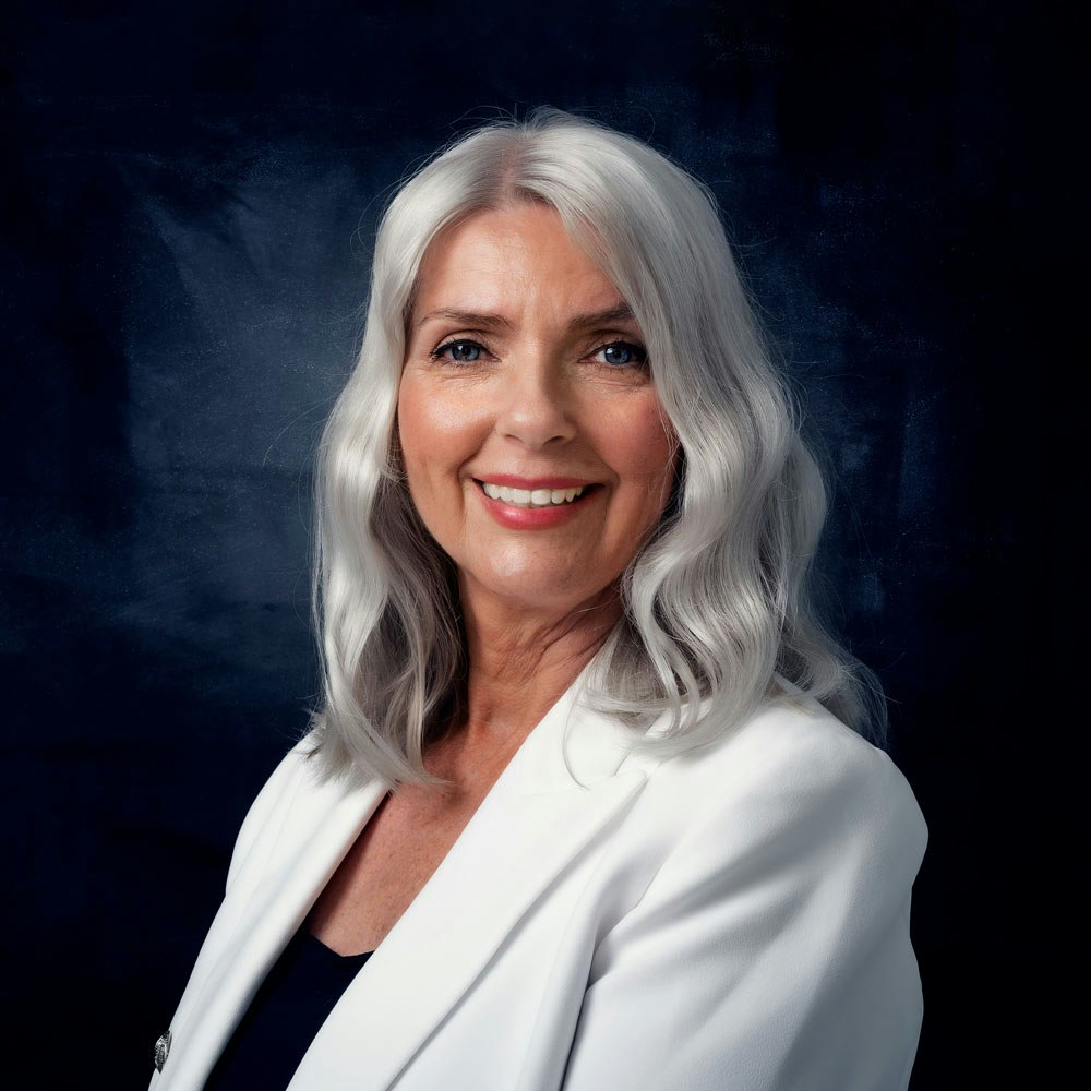 Mature classy woman with dentures smiling