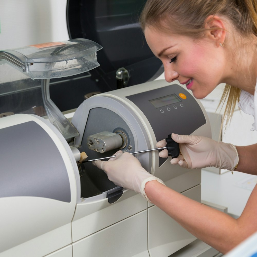 A technician at a Cerec machine