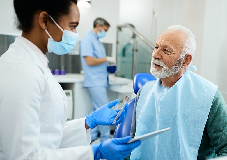 Dental staff educating patient