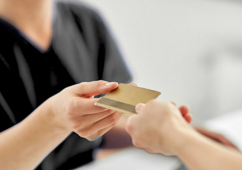 Dental patient paying with a credit card