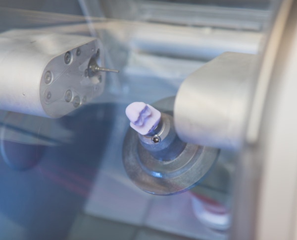 CEREC fabricating a dental crown from porcelain