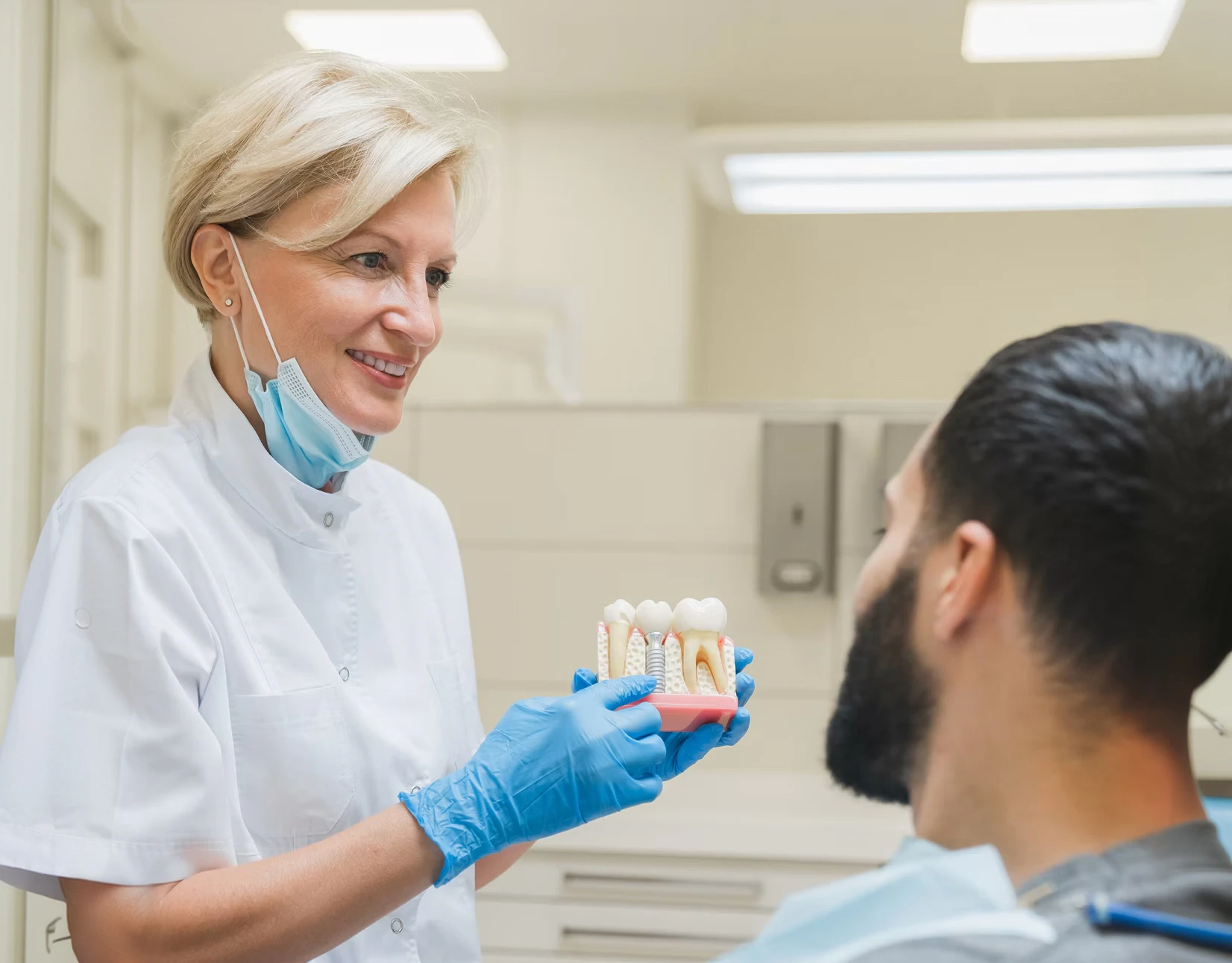 doctor explaining dental implants to a patient