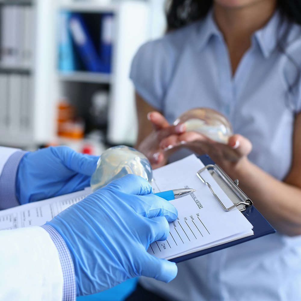 Breast augmentation patient wearing support garment