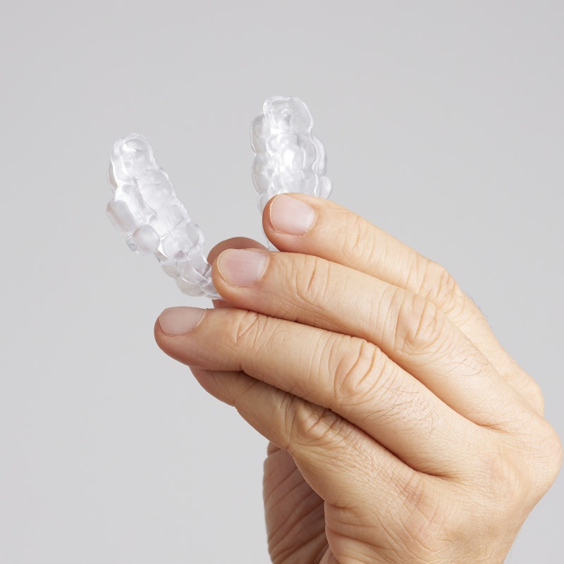 Person holding the ProSomnus oral appliance