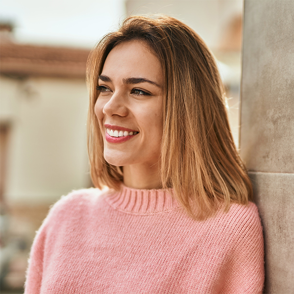 Smiling woman after cosmetic dentistry treatment