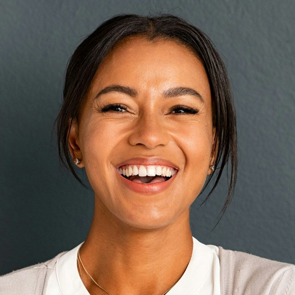 A woman smiling and laughing