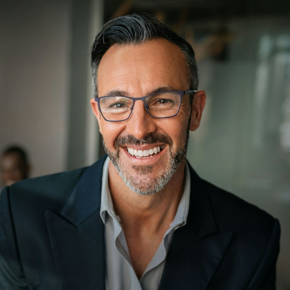 Smiling mature man at business meeting