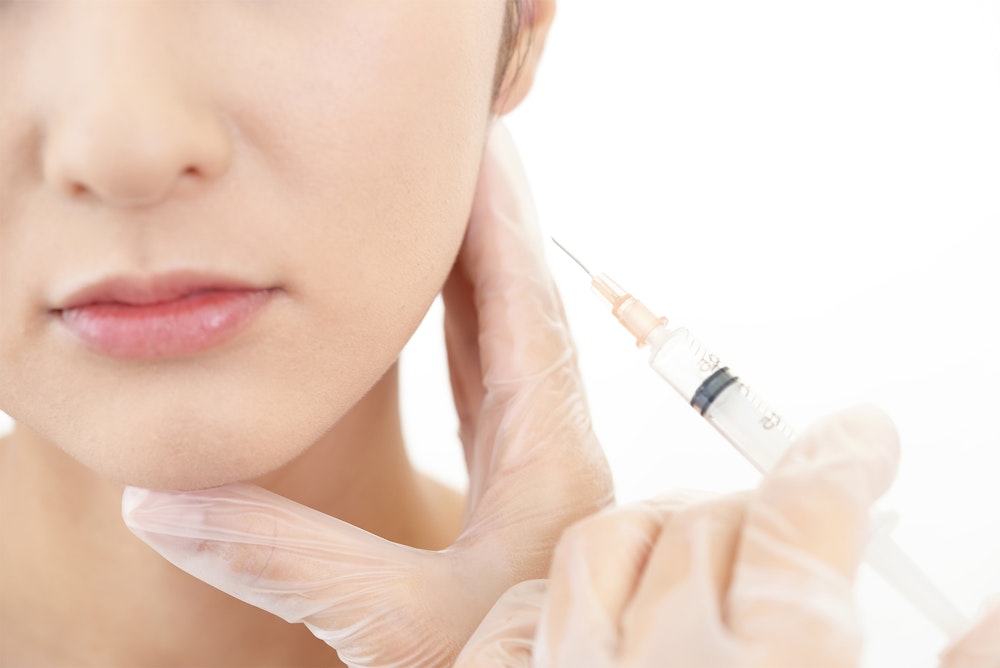 Woman receiving BOTOX in her jaw