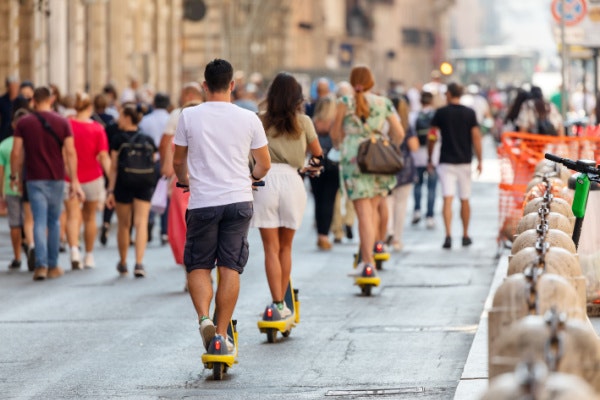 people riding e-scooters