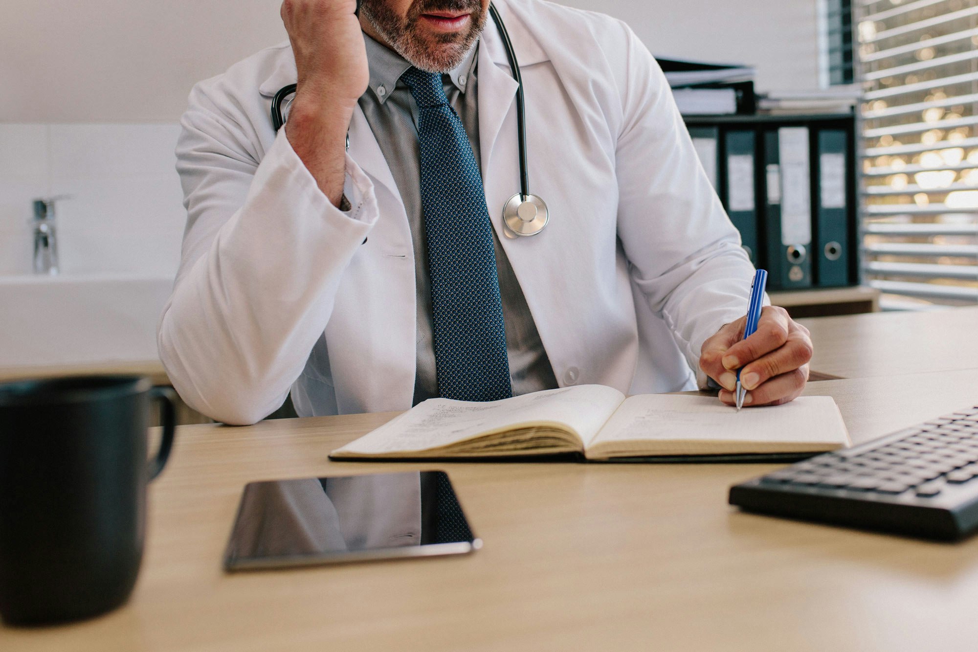 Doctor going through report