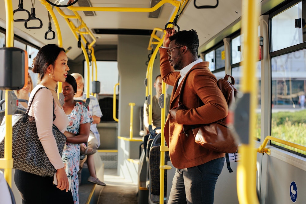 Man riding a bus in NYC