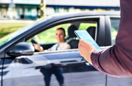 driver picking up passenger
