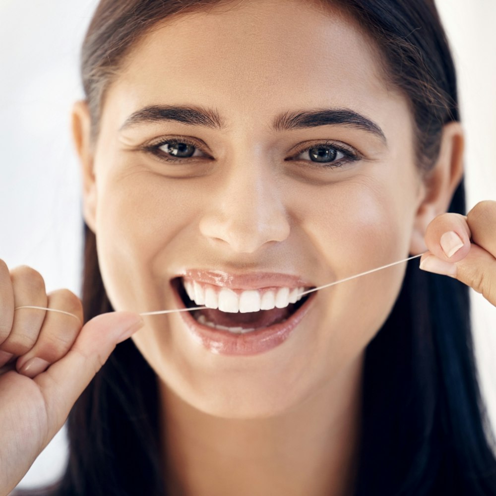 Woman flossing