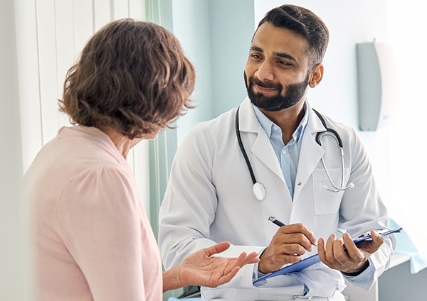 Medical professional consulting with breast reconstruction patient