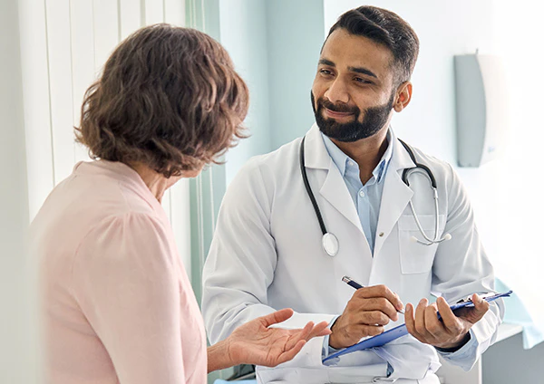 Medical professional consulting with breast reconstruction patient