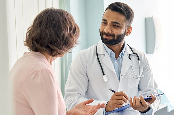 Doctor speaking with patient