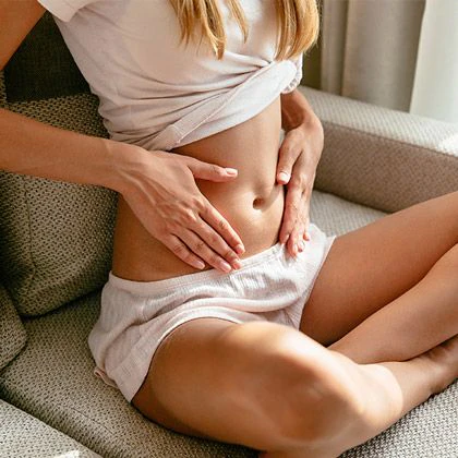 Woman with hands on belly