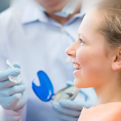 Doctor Providing Invisalign Aligners to Patient