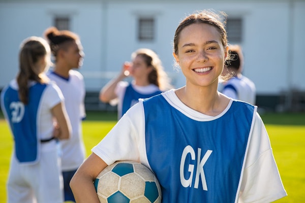 Happy female soccer player portrait