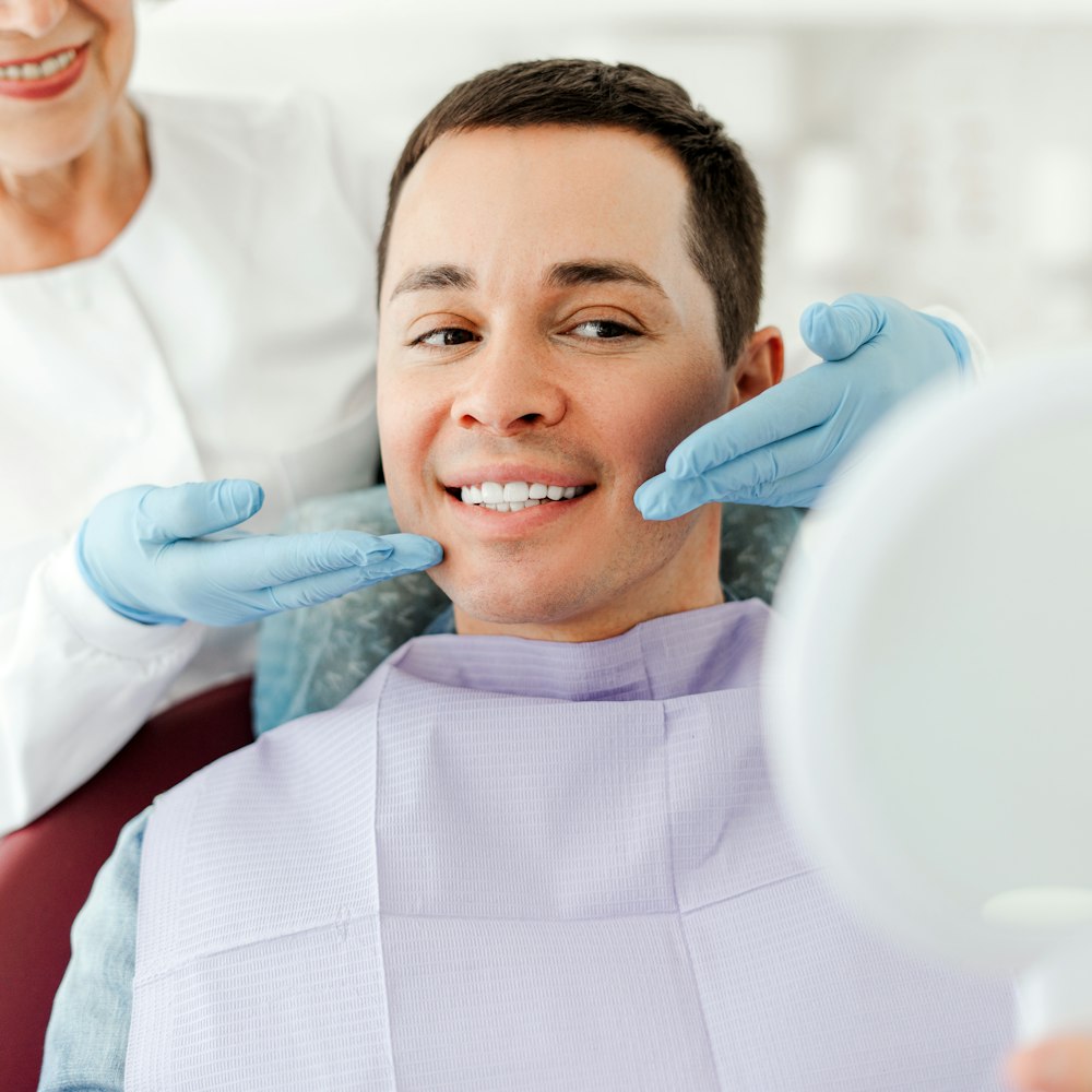 Man smiling at the dentist