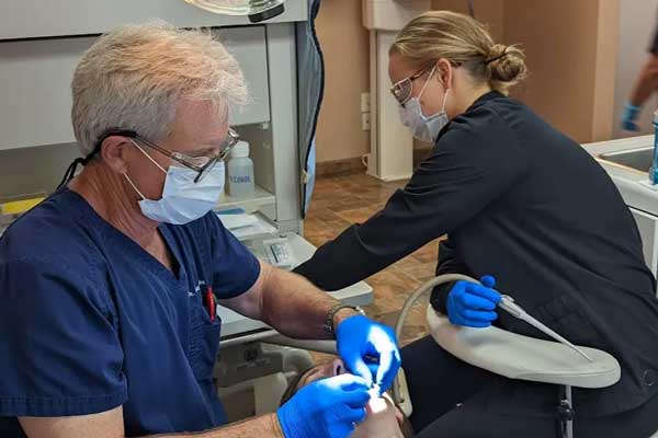 Dr. Stragier treating a patient