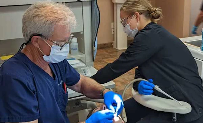 Dr. Stragier treating a patient