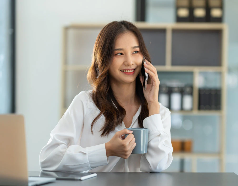 woman booking a dental consultation by phone