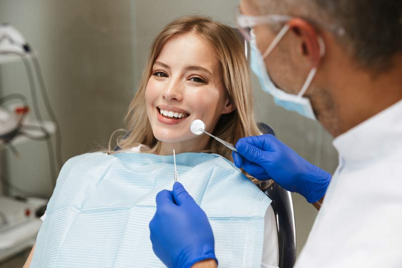 woman smiling in the dental chair