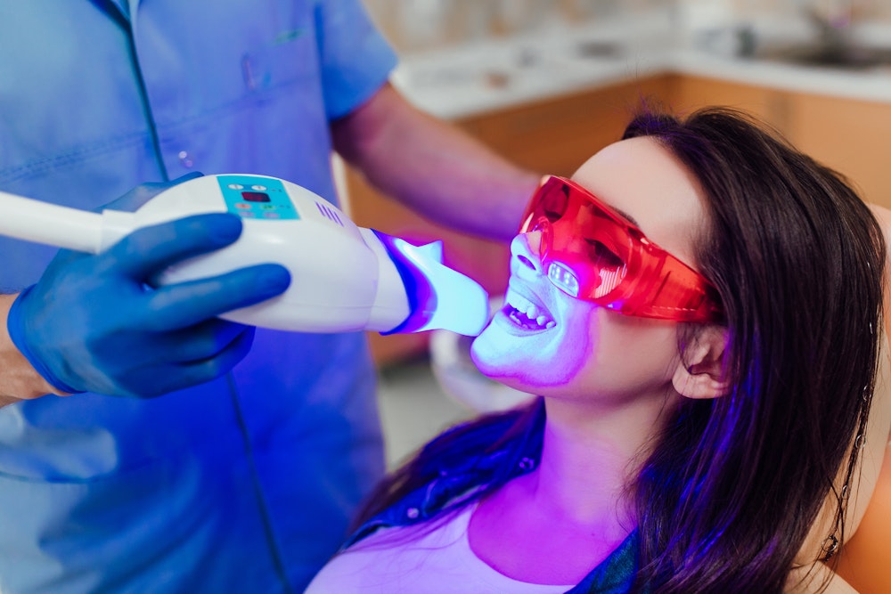 Patient getting teeth whitening treatment