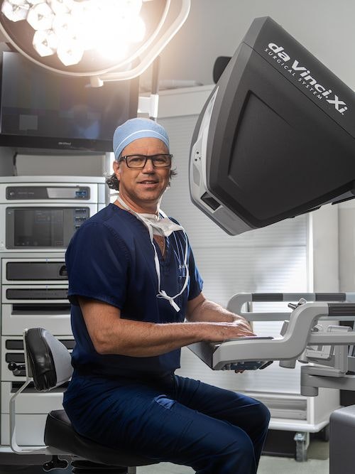 Dr. Cribbins using robotic surgery console