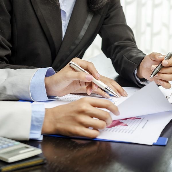 Two people reviewing financial documents for gastric sleeve surgery