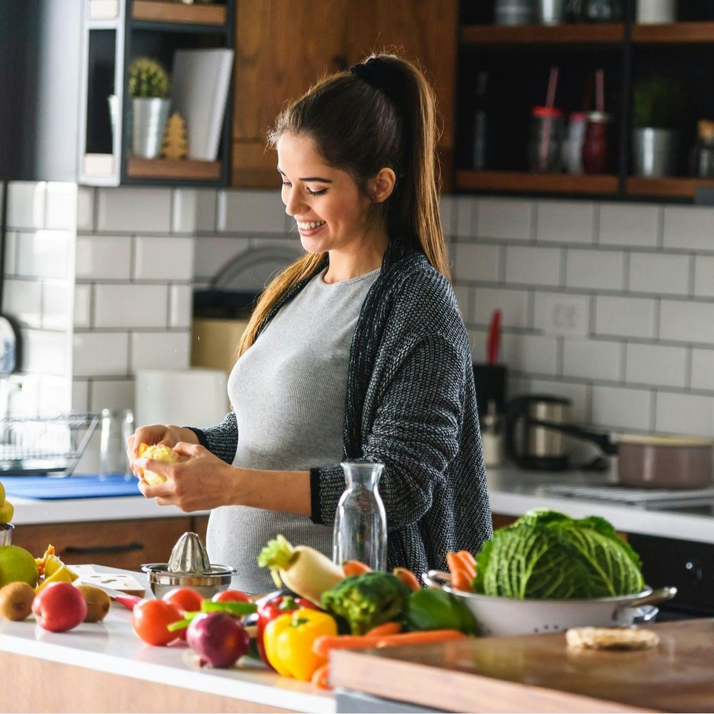 Pregnant woman cooking