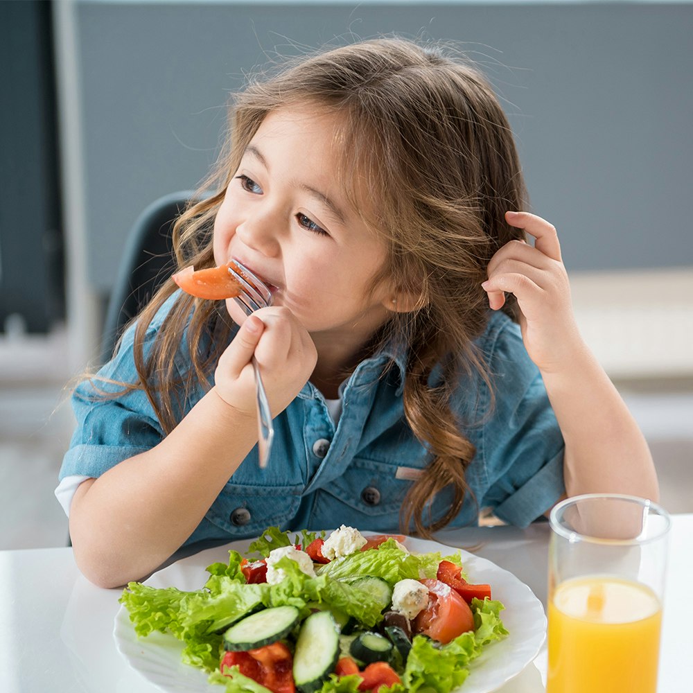 Smiling child eating
