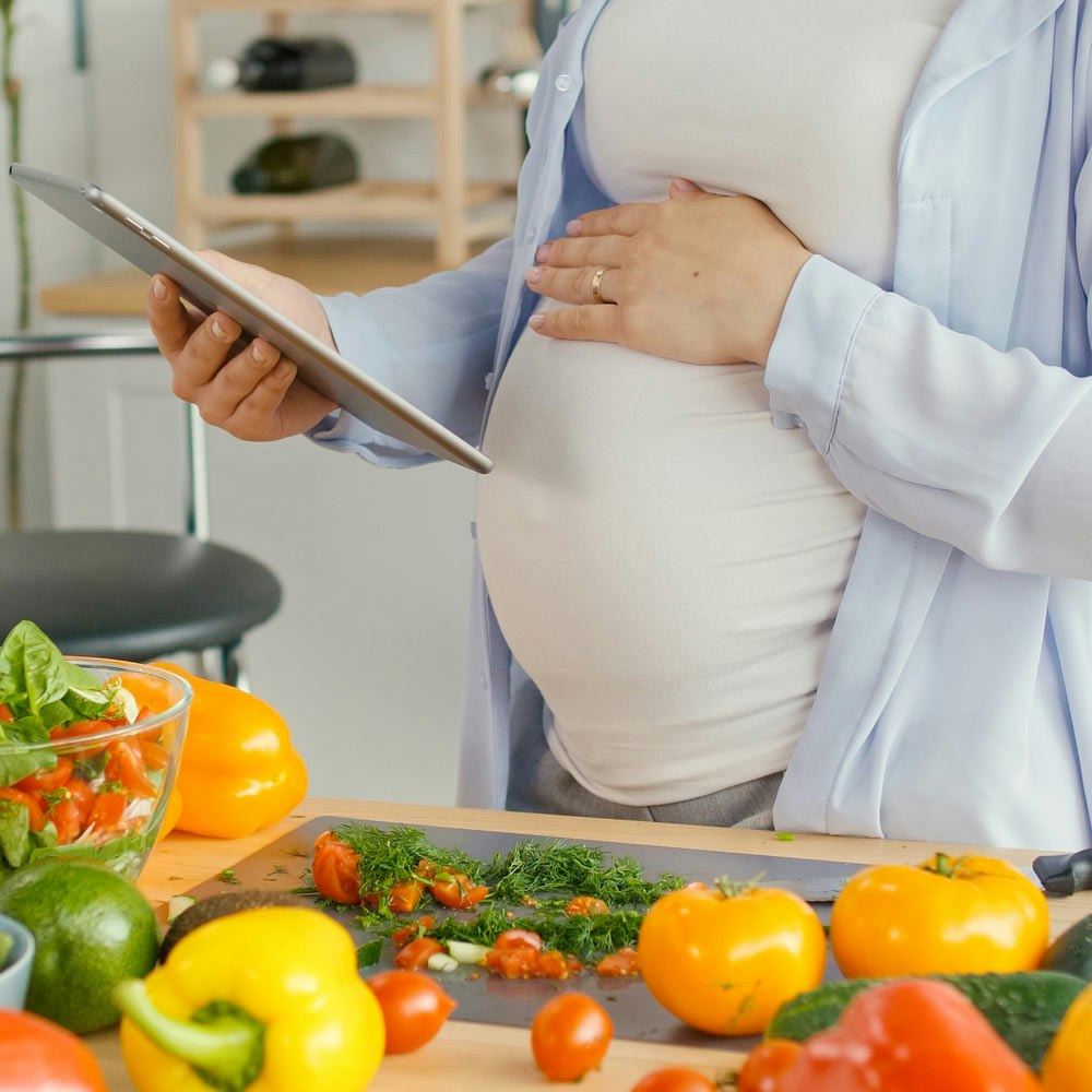 Pregnant woman cooking