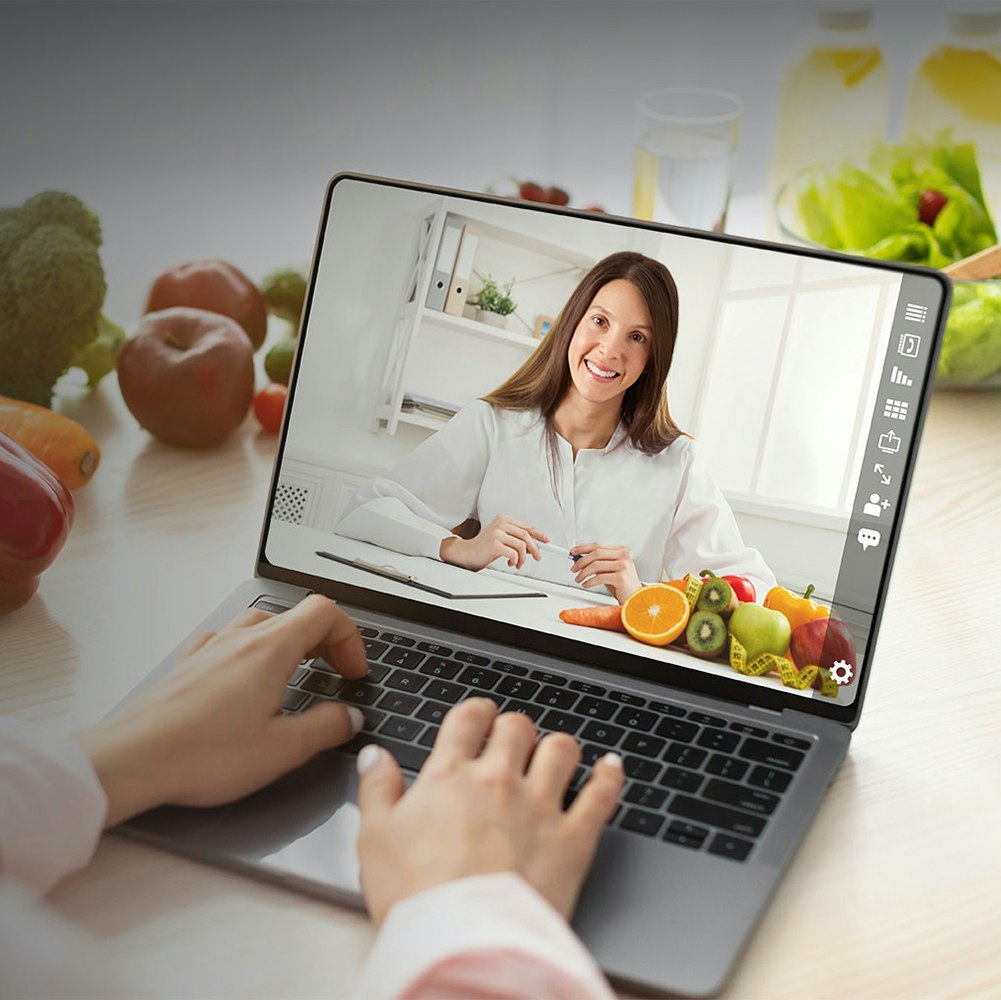 Allison Schulman on laptop screen hosting virtual nutrition consultation