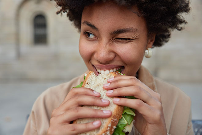 Teen eating a sandwich