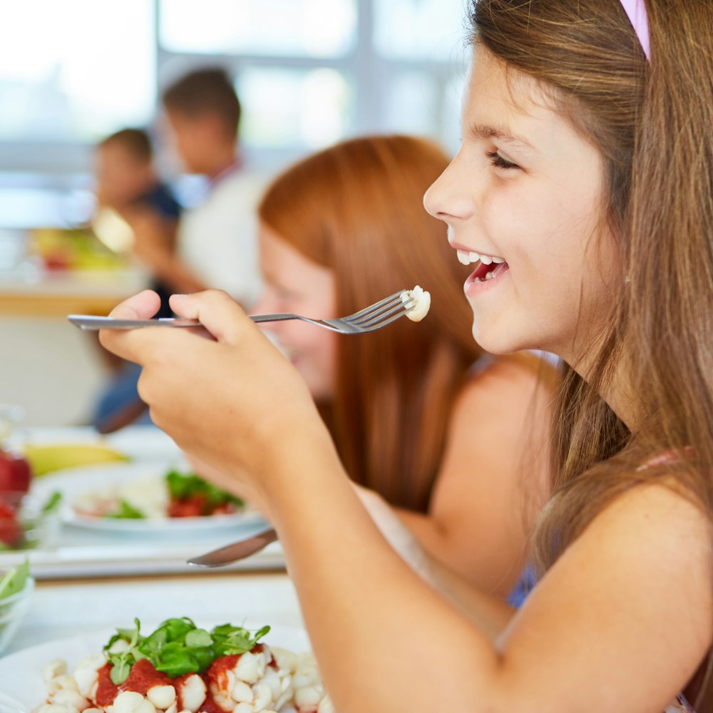 Child eating a school lunch